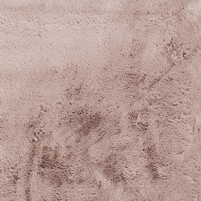 close up on material and colour of soft rose pink rug