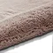 image of soft rose pink rug rolled up on one end