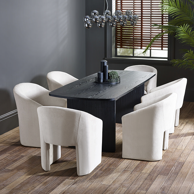 image of six matching cream tub chairs around a black rectangular dining table