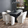 image of six matching cream tub chairs around a black rectangular dining table