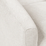 close up image on cream fabric of tub chair's arm