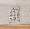 close up image of care instruction label on side of white fabric mattress