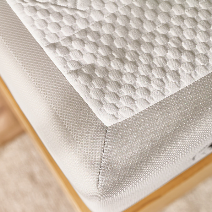 close up image of fabric of mattress on corner