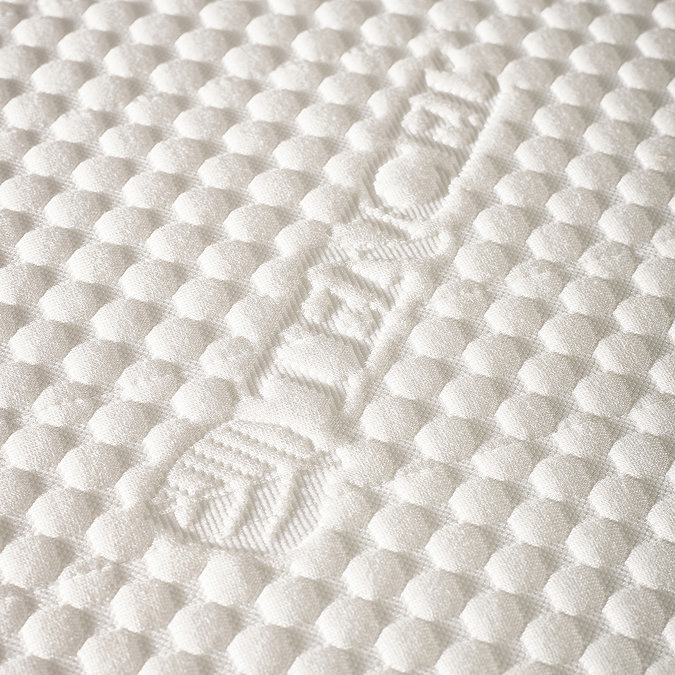 close ups watch image of top material of pocket sprung mattress, 'tencel' imprinted on it