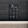 image of dark grey side of mattress with care label