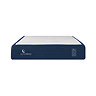 image cut out on white background of mattress with navy blue bottom half and white bobbled top