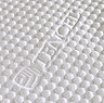 close up image on white bobbled tencel material of top of mattress