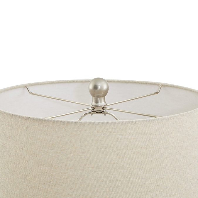 close up on top of cream coloured fabric lampshade