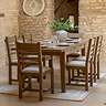 image of extended dining table with six chairs