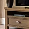 close up on drawer and shelf space of dark oak tv unit