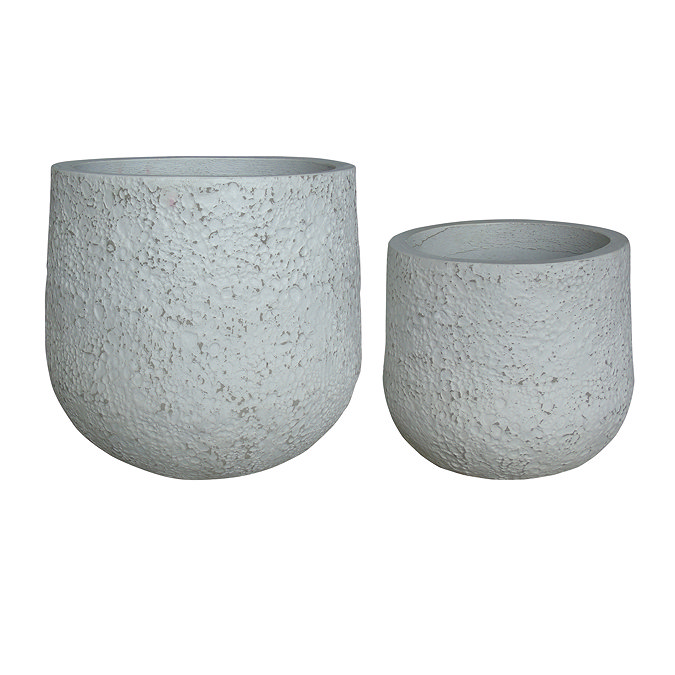 image cut out on white background of two rounded cement pots in dappled white, one slightly larger than the other