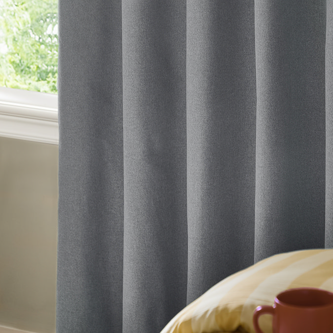 The Ultimate Blackout Eyelet Curtains in Denim over a window image