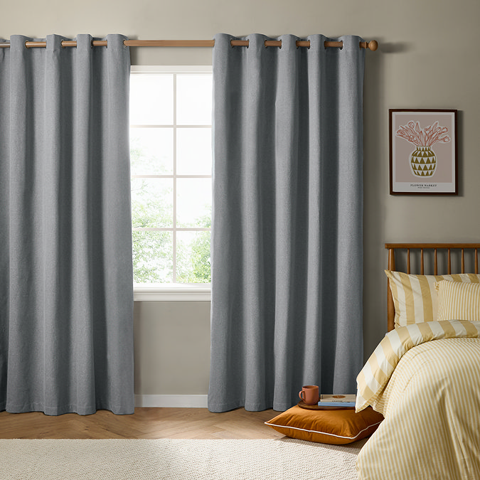 The Ultimate Blackout Eyelet Curtains in Denim over a window image