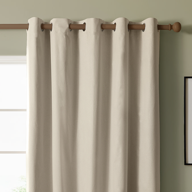 The Ultimate Blackout Eyelet Curtains in Ecru over a window image