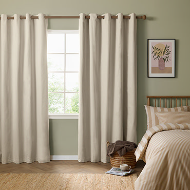 The Ultimate Blackout Eyelet Curtains in Ecru over a window image