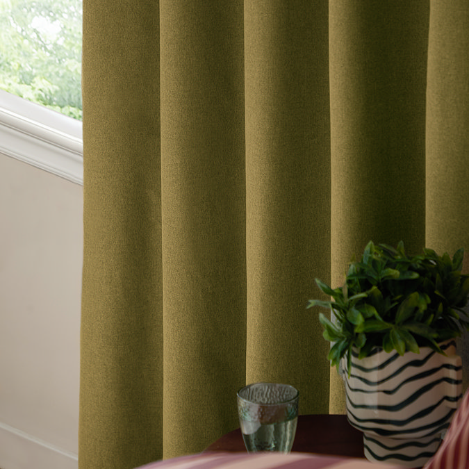 The Ultimate Blackout Eyelet Curtains in Forest over a window image