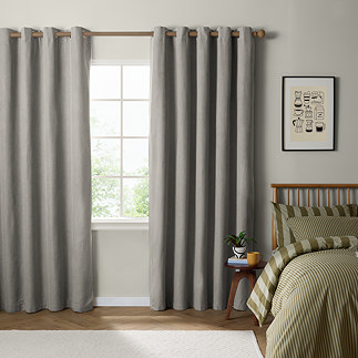 The Ultimate Blackout Eyelet Curtains in Grey over a window image