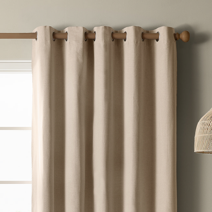 The Ultimate Blackout Eyelet Curtains in Natural over a window image