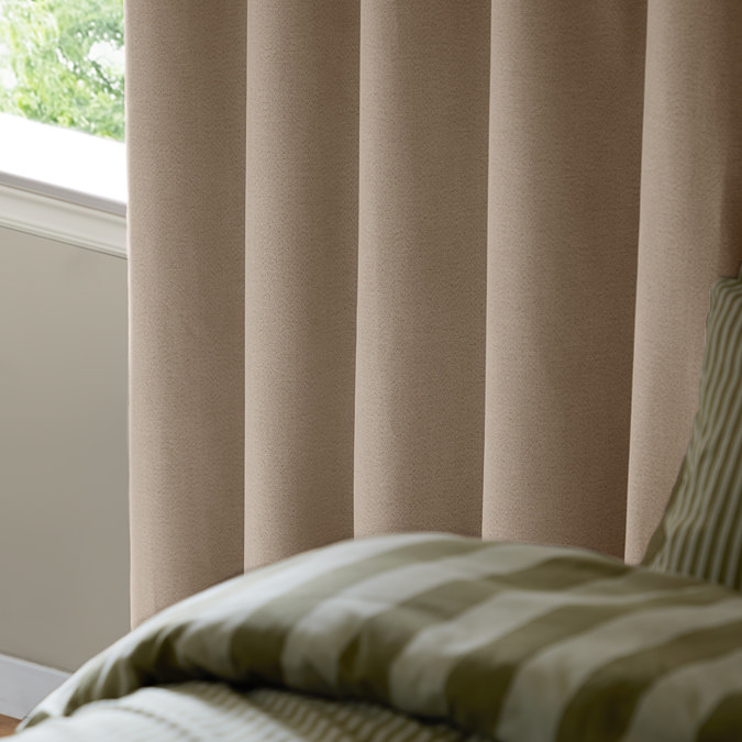 The Ultimate Blackout Eyelet Curtains in Natural over a window image