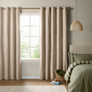 The Ultimate Blackout Eyelet Curtains in Natural over a window image