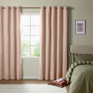 The Ultimate Blackout Eyelet Curtains in pink over a window image