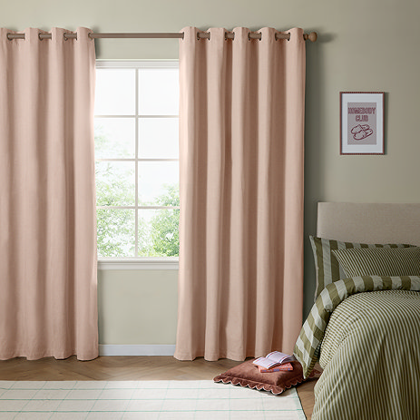 The Ultimate Blackout Eyelet Curtains in pink over a window image