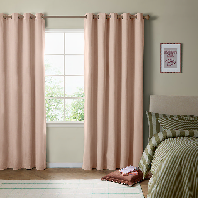 The Ultimate Blackout Eyelet Curtains in pink over a window image