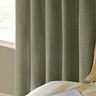 The Ultimate Blackout Eyelet Curtains in Sage over a window image