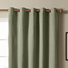 The Ultimate Blackout Eyelet Curtains in Sage over a window image
