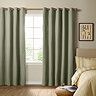 The Ultimate Blackout Eyelet Curtains in Sage over a window image