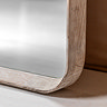 close up on bottom part of floor length mirror with limed oak edge and smooth glass