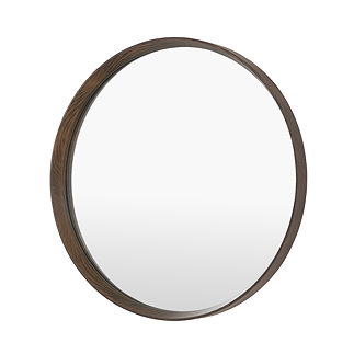 image cut out on white background of round wall mirror with walnut frame
