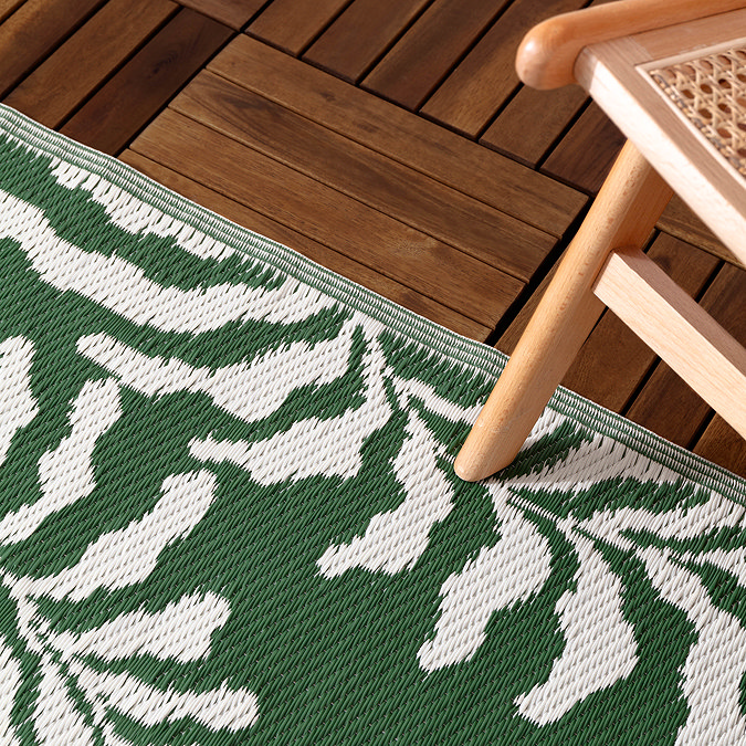 Tocorico outdoor rug in green and white on the floor image 2