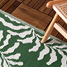 Tocorico outdoor rug in green and white on the floor image 2