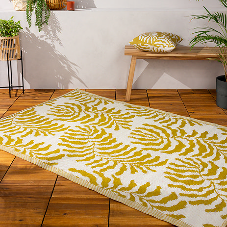 Tocorico rug mustard on floor image 1