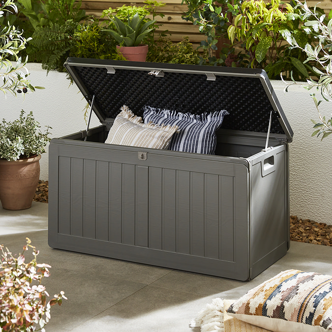 image of rectangular grey storage box with lid open to show cushions inside