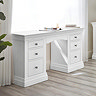 white pine dressing table with three drawers on each side, up against window