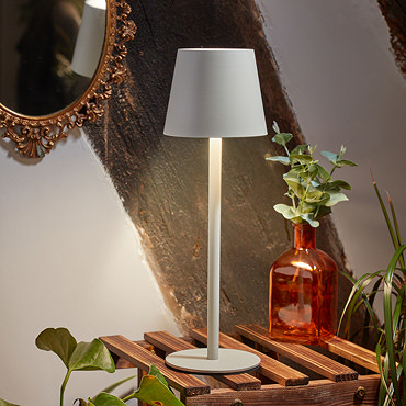 image cut out on white background of ivory table lamp with minimalist silhouette