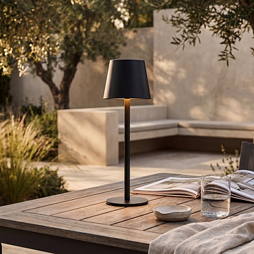 image cut out on white background of black modern table lamp