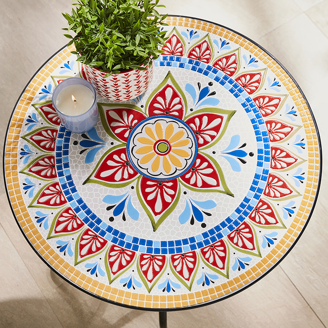 close up on pattern of colourful round bistro set