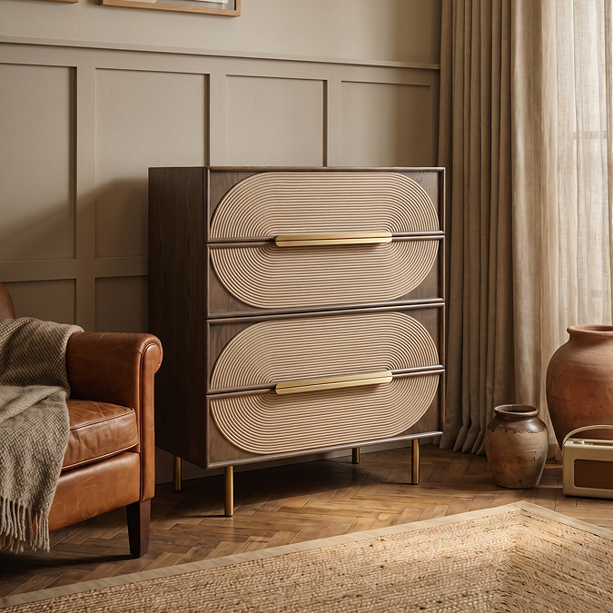 side on image of four drawer chest with four brassy handles and legs