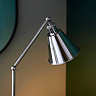 close up image of conical shade of nickel floor lamp with sleek, thin body