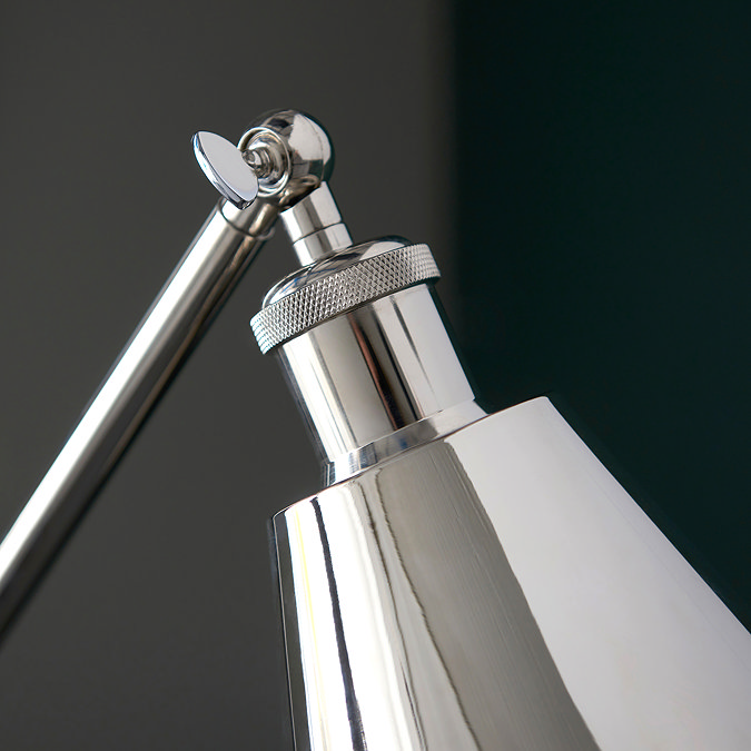 close up image of top of conical nickel shade of industrial-style floor lamp