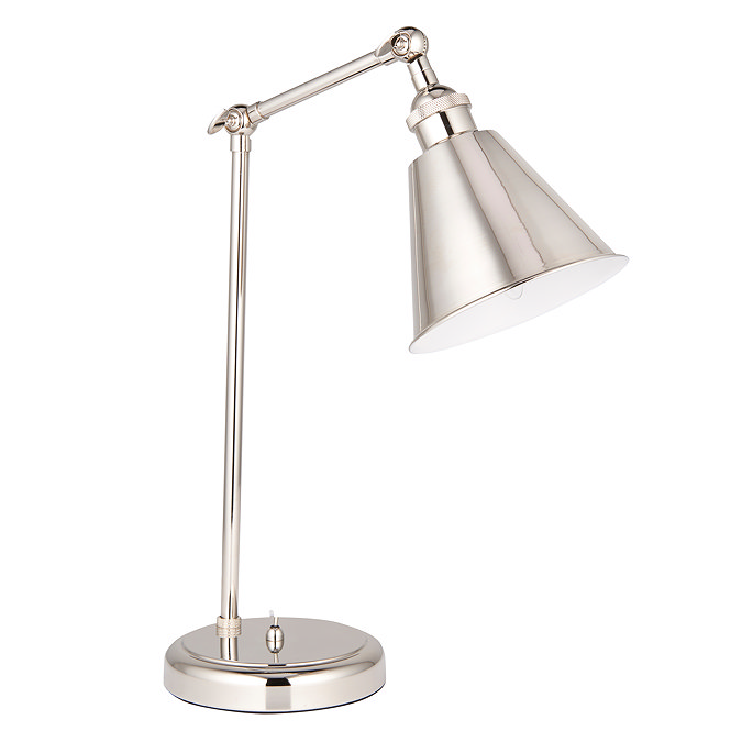 image cut out on white background of nickel coloured table lamp with conical shade