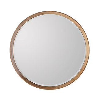 image cut out on white background of round mirror with light oak frame