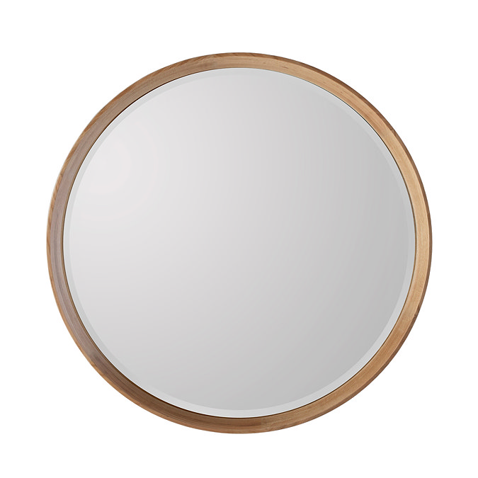image cut out on white background of round mirror with light oak frame