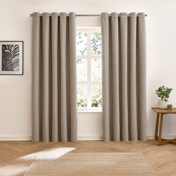 Verso Reversible Blackout Eyelet Curtains in charcoal, reverse side image over a window