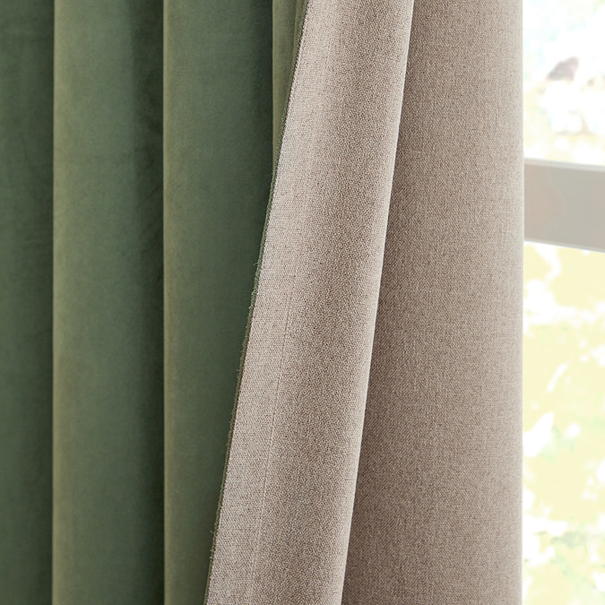 Verso Reversible Blackout Eyelet Curtains in Green close up texture image