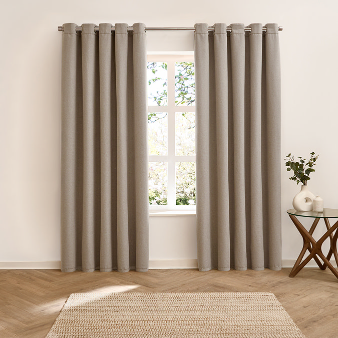 Verso Reversible Blackout Eyelet Curtains in Green over a window reverse side image