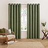 Verso Reversible Blackout Eyelet Curtains in Green over a window image